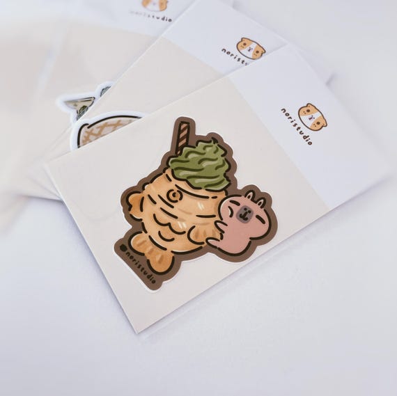 Moonch the Capybara with Taiyaki Ice Cream | Vinyl Sticker Moonch the Capybara with Taiyaki Ice Cream | Vinyl Sticker