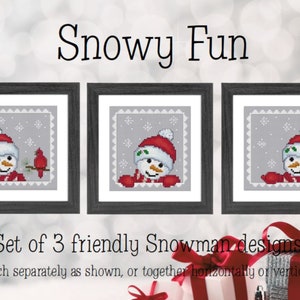 May include: Three framed cross-stitch designs featuring snowmen with red hats and scarves. One snowman has a bird on a branch. The text "Snowy Fun" and "Set of 3 friendly Snowman designs" are also visible.