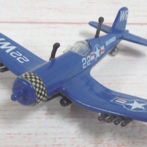 My daughter asked Santa for an airplane she can hold to fly around the  Christmas tree. I skipped  and found this vintage 1950's Die Cast  WWII Hellcat Fighter Plane for her