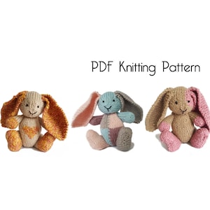 May include: PDF knitting pattern for three knitted bunny toys. The bunnies are in different color combinations: orange and brown, blue and gray, and pink and brown.