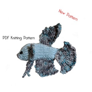 May include: A knitted blue and gray betta fish amigurumi toy. The PDF knitting pattern is available for purchase. New Pattern.