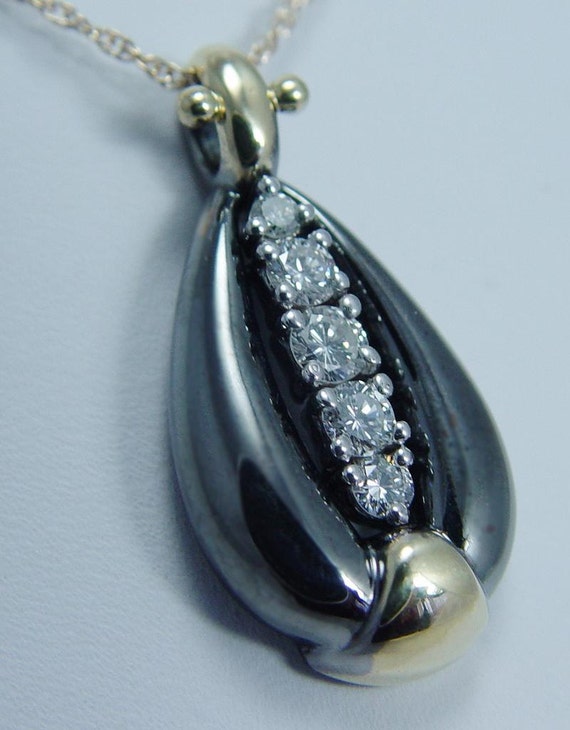 フレアクラフト 18K イエロー&ブラックゴールド 0.84ct VVS1/FG 