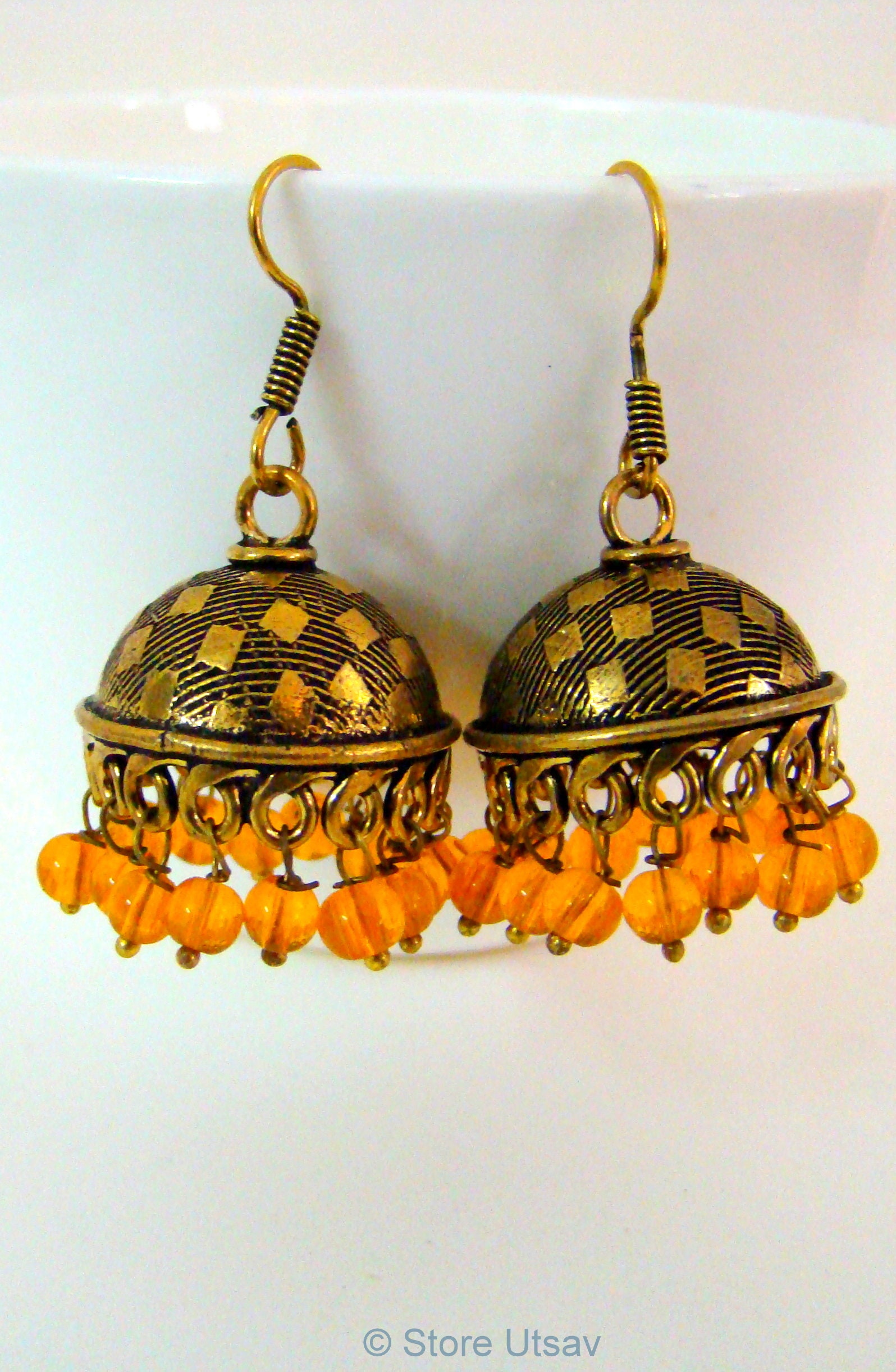 Yellow Engraved Copper Jhumka Oxidized With Yellow Handblown Glass