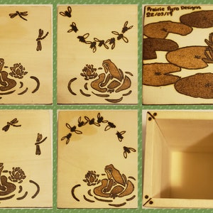 May include: A wooden box with a frog and lily pad design. The box is made of light wood and has a natural finish. The lid of the box is decorated with a frog sitting on a lily pad. The box is open and the inside is empty. The box is a great way to store small items or trinkets.