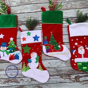 May include: Four red Christmas stockings with various designs. One features a snowman, Christmas tree, and presents. Another has a snowman with stars. The third has a Christmas tree on a sleigh. The last has Santa Claus in a chimney. Each has a green cuff.