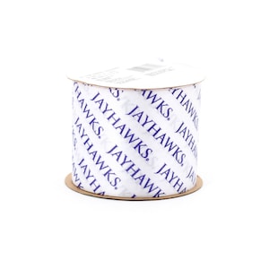 May include: A white ribbon spool with a blue and white diagonal pattern. The ribbon is printed with the text "JAYHAWKS".