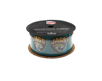 May include: A roll of green decorative ribbon with the Jacksonville Jaguars logo and the words "JAGS" printed on it. The ribbon is labeled "Decorative Ribbon Cinta Decorativa" and "NFL Properties, LLC".