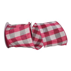 May include: A roll of wired ribbon featuring a repeating buffalo check pattern in vibrant shades of hot pink and white. The fabric has a visible woven texture and the edges are finished with a thin, flexible wire to maintain its shape when tied.