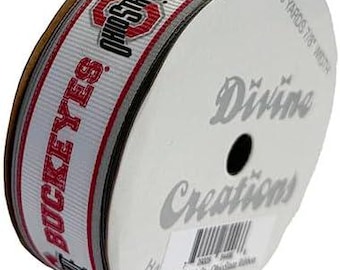 May include: A roll of white and grey ribbon with the Ohio State Buckeyes logo and the text "Ohio State Buckeyes" in red. The ribbon is 3 yards long and 1.75 inches wide. The label on the roll says "Divine Creations".