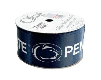 May include: A roll of navy blue satin ribbon with a white Penn State Nittany Lion logo and the words "Penn State" printed on it.