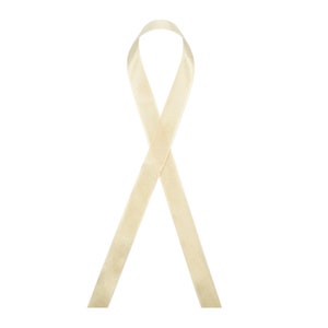 May include: A cream-coloured satin ribbon tied in a loop, symbolising awareness and support.