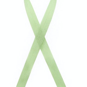 May include: A light green ribbon tied in a bow, a symbol of awareness and support.