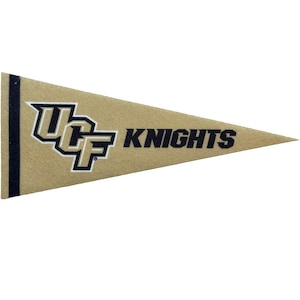 May include: A triangular felt pennant in a gold colour featuring a black vertical stripe on the left side. The design includes the black and white UCF logo and the word KNIGHTS printed in bold black capital letters across the centre surface.