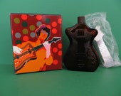 Avon Bottle titled Electric Guitar Decanter with box and cap still sealed in plastic from 1974