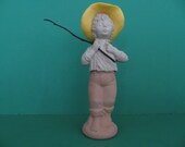 Avon bottle titled Catch-A-Fish bottle shaped like a boy with his fishing pole and a hat from 1976