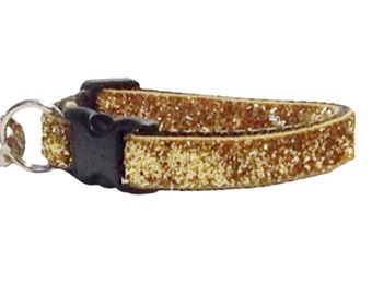May include: A gold glitter cat collar with a black breakaway buckle.