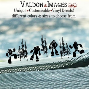 May include: Black and white silhouette vinyl decals of robots and pine trees. The decals are arranged in a row on a car window.
