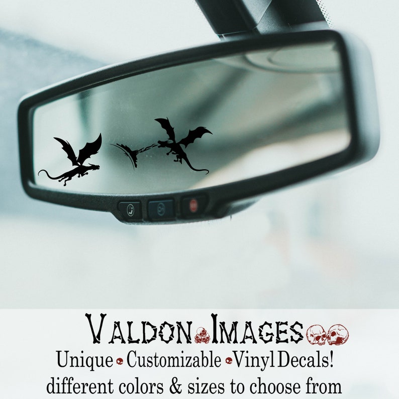 May include: Black silhouette of three dragons flying in a car's rearview mirror. The image is a product listing for customizable vinyl decals. The text "VALDON IMAGES" is at the bottom of the image.