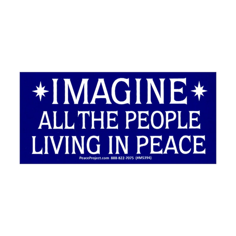 May include: A blue rectangular sign with white text that reads "*IMAGINE* ALL THE PEOPLE LIVING IN PEACE" and a website address and phone number at the bottom.
