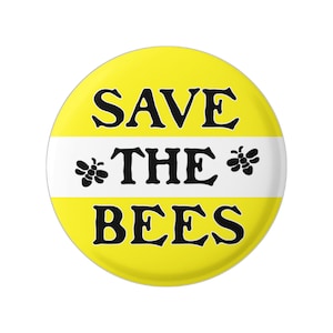 May include: A yellow button with a white stripe and black text that reads "Save the Bees". Two black bee silhouettes are on either side of the word "the".