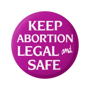 May include: A pink button with the text "KEEP ABORTION LEGAL and SAFE" in white.