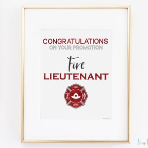 May include: A white printable sign with the text "Congratulations on your promotion Fire Lieutenant" and a red fire department badge with a white helmet.