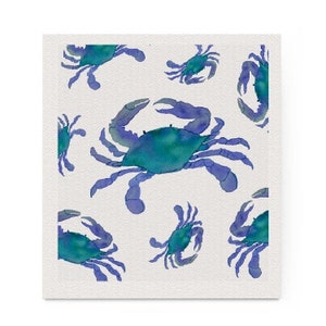 May include: Watercolor illustration featuring a pattern of blue crabs on a white background. The crabs have teal bodies and blue claws and legs. The design is repeated across the surface.