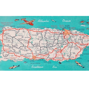 May include: A vintage map of Puerto Rico with a turquoise background, showing major cities, towns, and roads. The map includes a compass, a plane, and fish illustrations. The text "SAN JUAN" is highlighted in red.