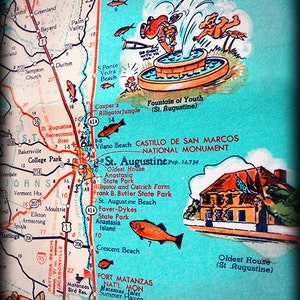 May include: A vintage map of St. Augustine, Florida, with a cartoon illustration of a fountain of youth. The map highlights various points of interest, including the Castillo de San Marcos National Monument, the Oldest House, and the Anastasia State Park. The map also includes a small illustration of a plane.