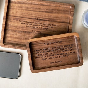 May include: Two rectangular wooden trays with dark brown wood grain. The larger tray is engraved with: To My Dad, You will always be the first man I ever loved. Thank you for always walking beside me... today, tomorrow and always. Love, Bonnie. The smaller tray reads: To My Father in Law, I want to specially thank you for raising the man of my dreams and instilling the right values in him. You have been the best role model and he is proud to be your son. I am so lucky I get to call you family. Love, Carolyn.