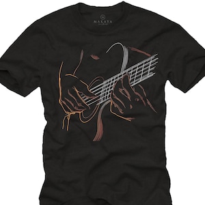 May include: Black t-shirt featuring a line drawing of a person playing a guitar. The illustration is in shades of orange and white, with the guitar strings and fretboard clearly visible. The brand name "MAKAYA" is printed at the top.