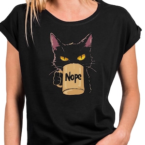 May include: A white ceramic mug with a black handle and the text "But First, Coffee" in a black, bold font. The mug is likely 11-15 ounces in size, perfect for a morning beverage.