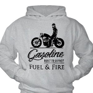 May include: A gray hoodie with a black and white illustration of a motorcycle and the text "Gasoline Built to go fast Fuel & Fire".