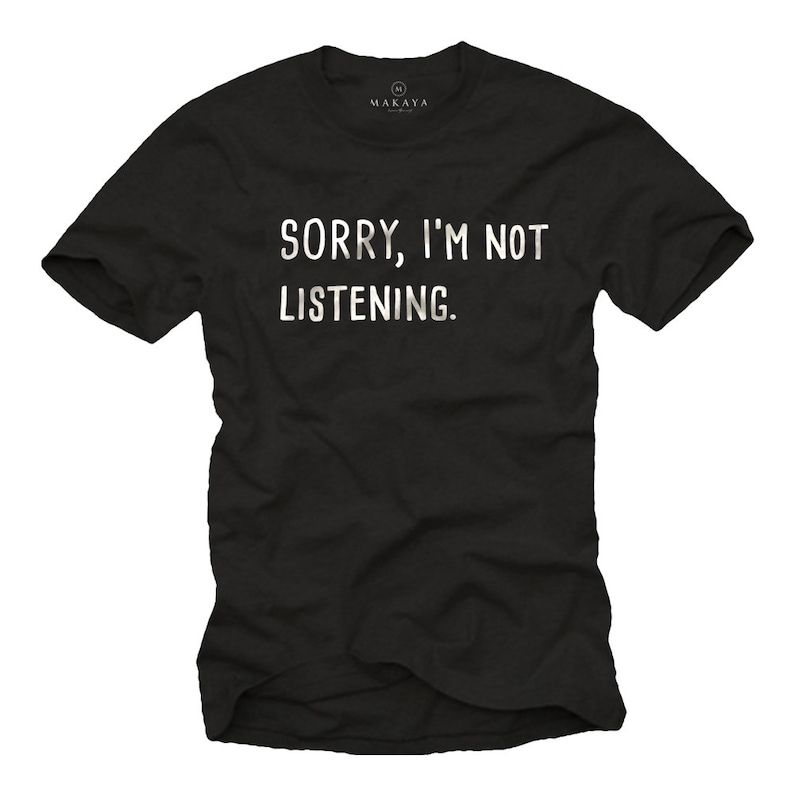 May include: Black t-shirt with the text "SORRY, I'M NOT LISTENING" in white block letters. The shirt has short sleeves and a crew neck. The brand name "MAKAYA" is printed on the upper right side of the shirt.