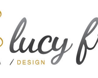 May include: Logo design featuring the name "lucy fry" in a stylish, cursive font, with a needle and thread graphic. The needle is gray, and the thread is gold. The word "DESIGN" appears below the name.