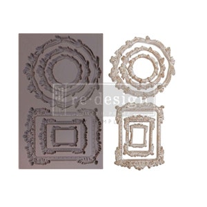 May include: A collection of decorative frame molds and finished frames. The molds are gray and feature ornate, floral designs in various sizes and shapes. The finished frames are white with a distressed finish, showcasing the same intricate details. The text "re-design with prima" is visible.