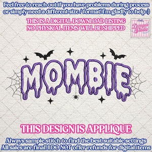 May include: A digital embroidery design featuring the purple text MOMBIE in a dripping font style. The design includes black embroidered accents of two bats, a spider hanging from a web, four-pointed stars, and spiderwebs on both ends.