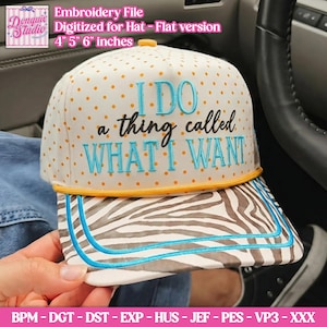 May include: A white baseball cap with orange polka dots and a zebra-striped brim. The front features embroidered text in light blue and black that reads: I DO a thing called WHAT I WANT. The cap includes a yellow cord trim and measures 4, 5, 6 inches.