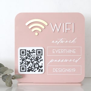 May include: A pink WiFi sign with a QR code and the words "WIFI", "network", "password", and "DESIGN619". The sign also displays the network name "EVERTHINE". The WiFi symbol is at the top.