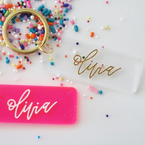 custom calligraphy name keychain | clear or fluorescent pink | back to school | personalized | gift | backpack | key chain | bag | name tag