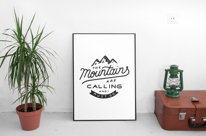 May include: Black and white print with the text "The Mountains Are Calling And I Must Go" with a graphic of three mountain peaks.