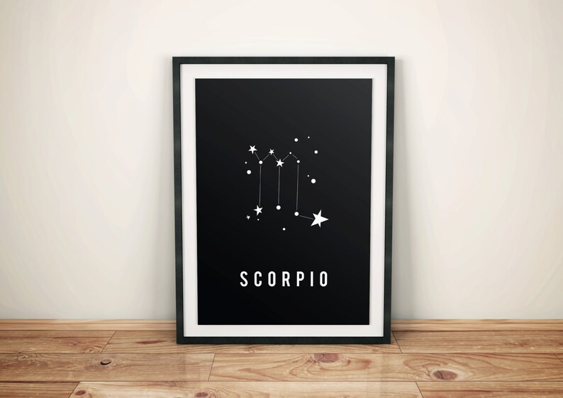 May include: Black and white print of the Scorpio constellation with the word "SCORPIO" printed below. The print is framed in a black frame.