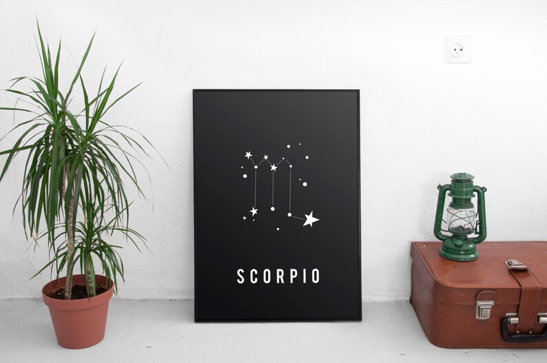 May include: Black and white print of the Scorpio constellation with the word "SCORPIO" in white text on a black background.