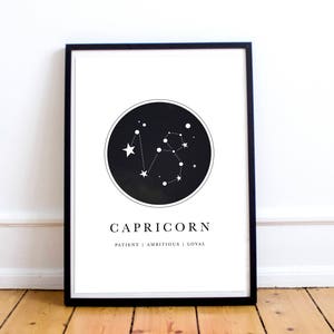 May include: Black and white printable art print featuring the constellation Capricorn with the text "Capricorn, Patient | Ambitious | Loyal".