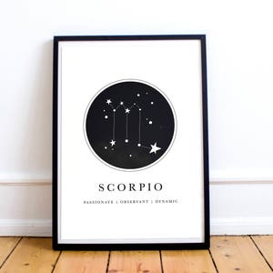 May include: Black and white printable art print with a constellation design for the zodiac sign Scorpio. The print features a black circle with white stars and the text "Scorpio" and "Passionate | Observant | Dynamic" below the circle.