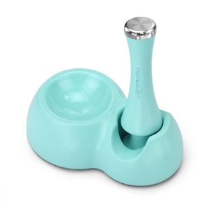 May include: A light blue pet food and water bowl set with a stainless steel dispenser. The dispenser has the word "Progress" printed on it.