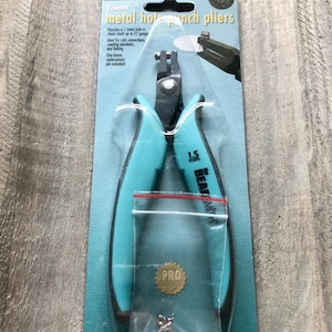 May include: A turquoise blue metal hole punch pliers with a 1.5mm punch capacity. The packaging features the text "COLD CONNECTION 1.5mm metal hole punch pliers" and "The Beadsmith".