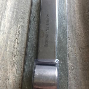 May include: A silver metal tool labeled "Beadsmith EZ-Bender" for making cuff bracelets.