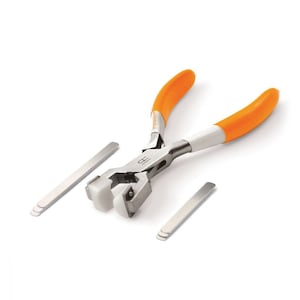 May include: Orange handled pliers with white jaws for crimping metal. The pliers are on a white surface with three metal strips.