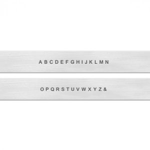 May include: Two metal strips with the alphabet printed on them. The top strip shows the letters A through N, and the bottom strip shows the letters O through Z and an ampersand.